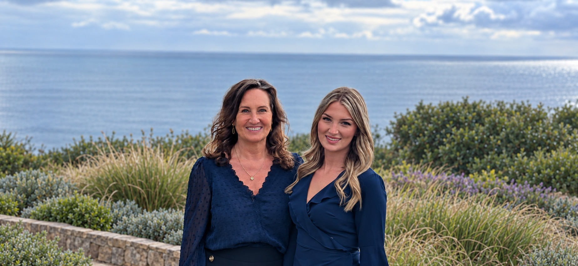 Debbie Willmott and Elisha Bayley in a landscaped coastal garden